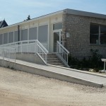 Mise aux normes des ateliers bois et création d’une rampe en béton armé pour accès des handicapés à la salle de restaurant à Olivet.